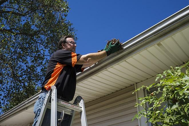 handyman installing a new gutter system in Branchburg, NJ